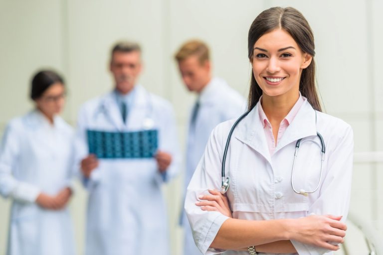 Group successful doctors in hospital background